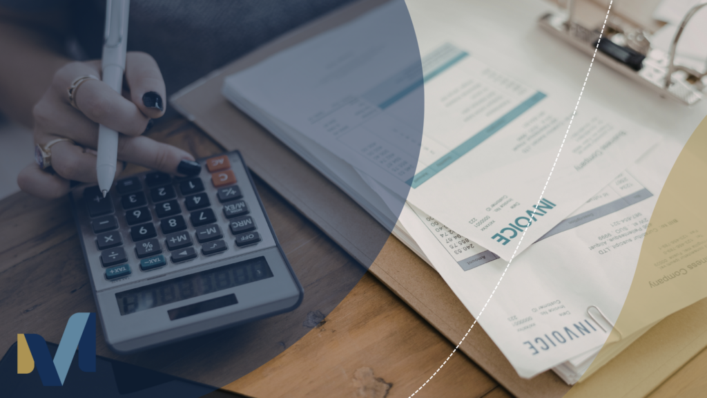Medical billing paperwork with calculator and invoice documents on a desk, representing healthcare billing and financial administration.